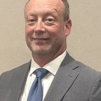 Official portrait of David Bailey
